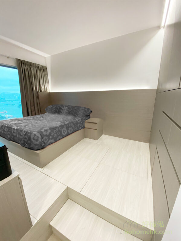 床頭板由地台床一直伸延到衣櫃邊，成為睡房的特色牆