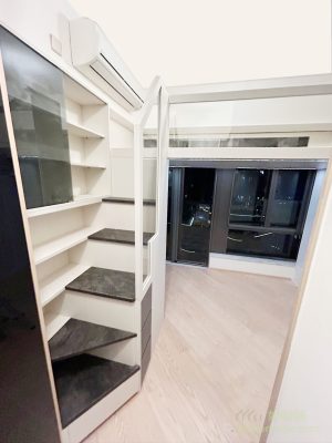 Next to the staircases, there is a whole row of glass decorative cabinets and bookcases for displaying ornaments and storing books.