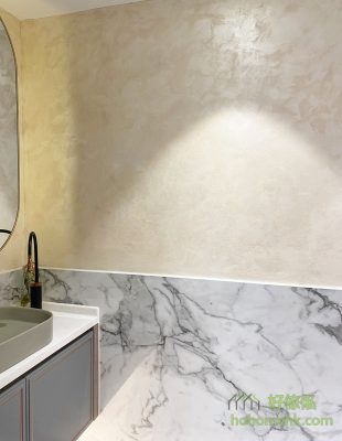 The wall next to the bathroom cabinet has been made into a painting art wall, and the color and effect can be discussed with the painter. The bottom half of the wall is covered with rock panels, waterproof and can be complete, there is no gap in the tile.