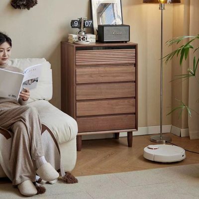 The empty space next to the sofa seems to be reserved for it, acting as a small side cabinet of the sofa, and an orderly "debris manager".